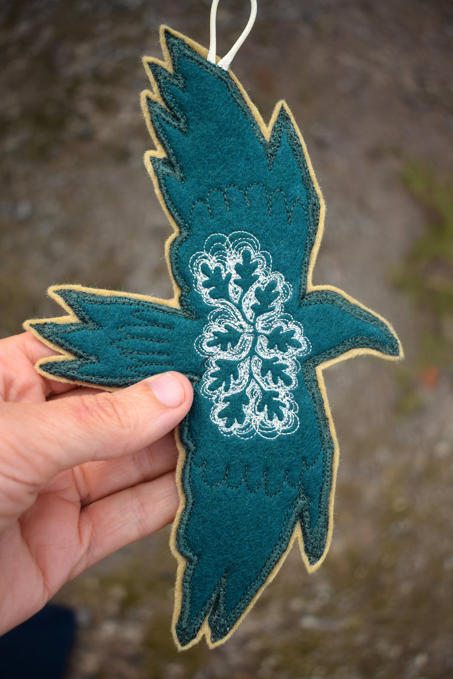 Embroidered leafy bird wall hanging