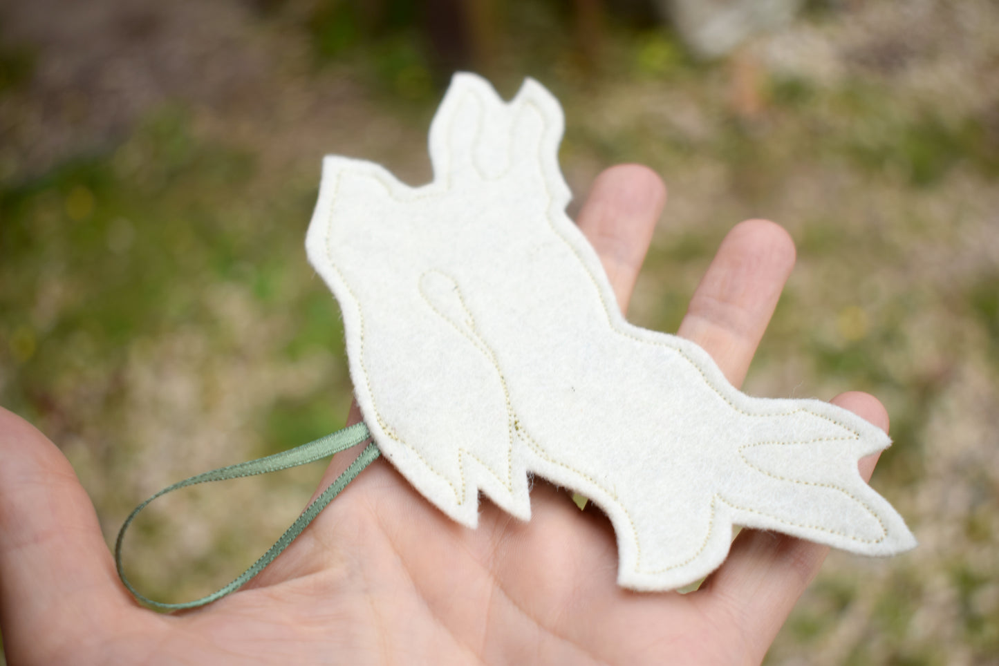 Embroidered felt hare wall hanging