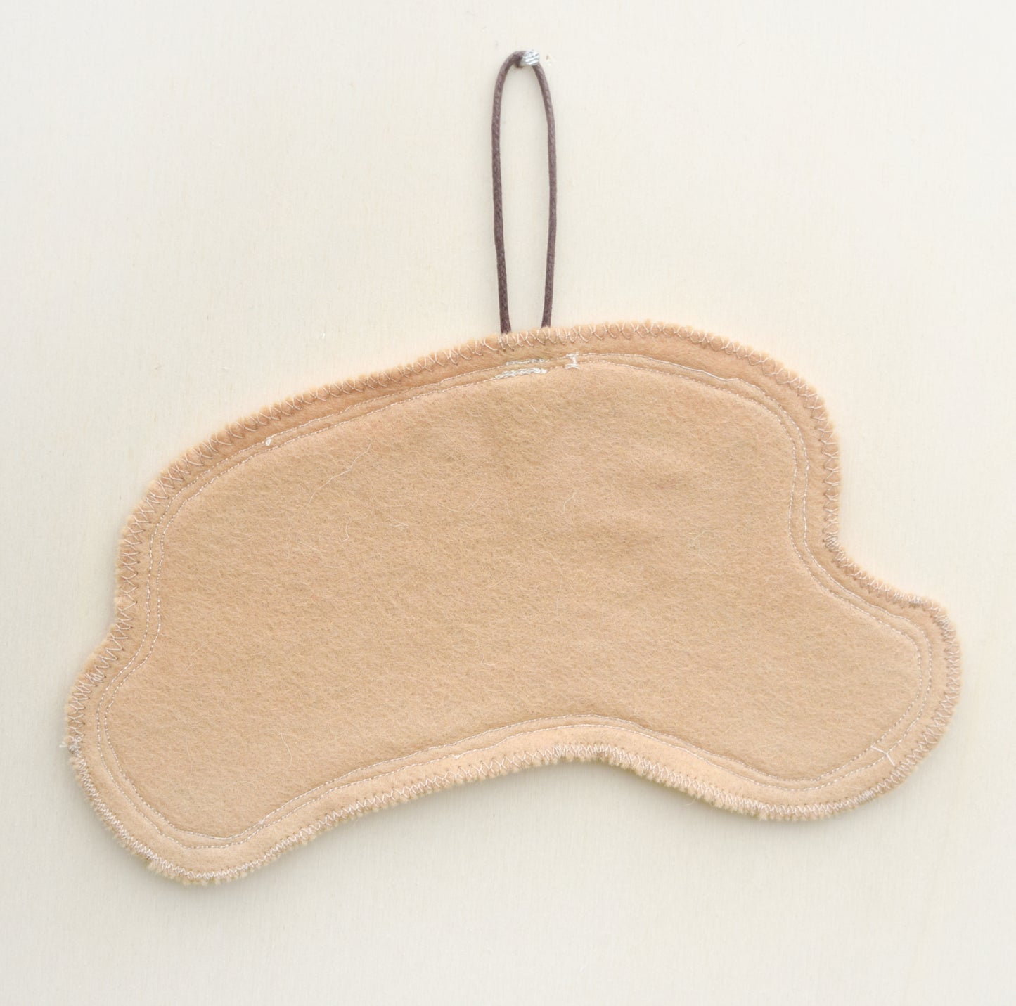 Embroidered leafy hare wall hanging