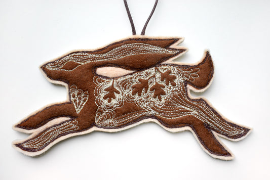 Embroidered leafy hare wall hanging