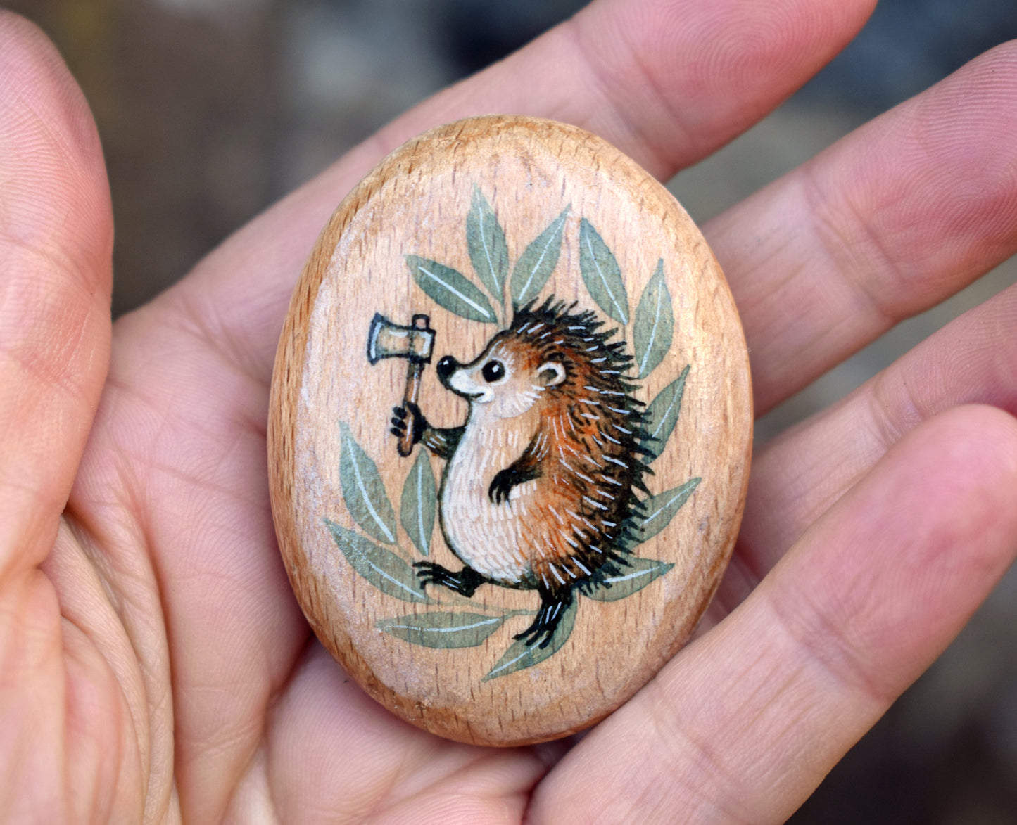 MINI Pebble - Hedgehog with Axe. Watercolour painting on Beech wood