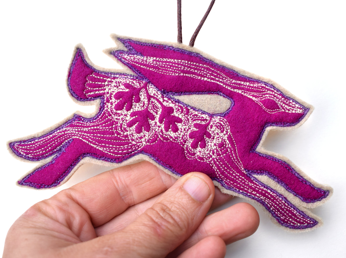 Embroidered leafy hare wall hanging
