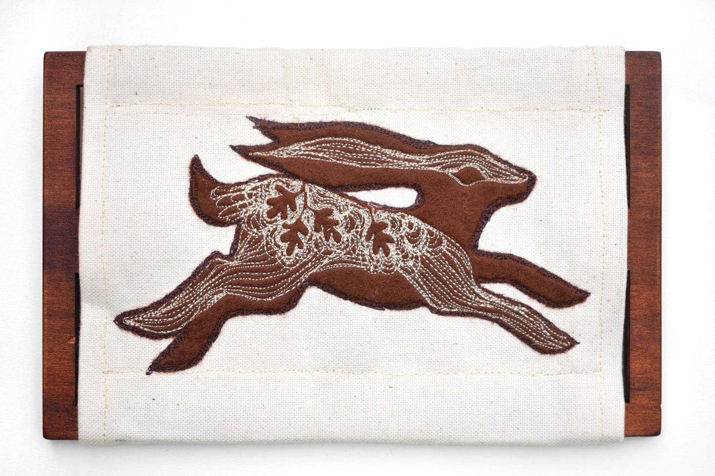 Embroidered leafy hare wall hanging