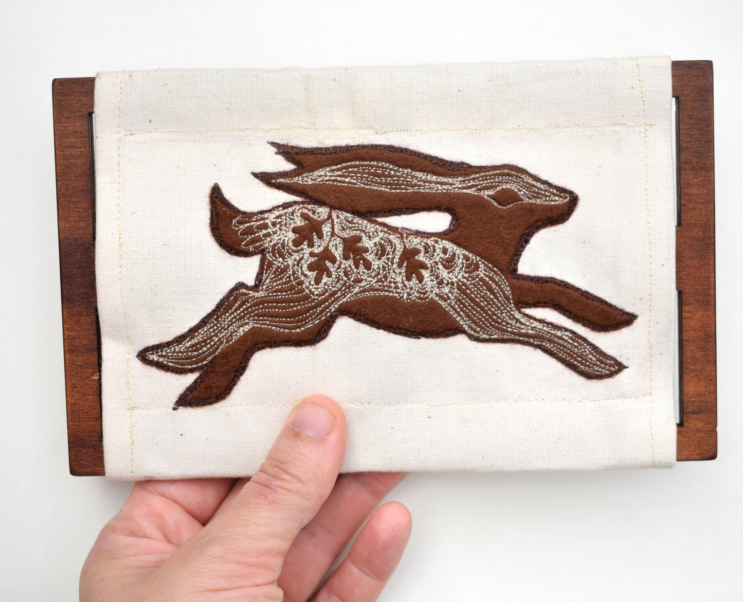 Embroidered leafy hare wall hanging