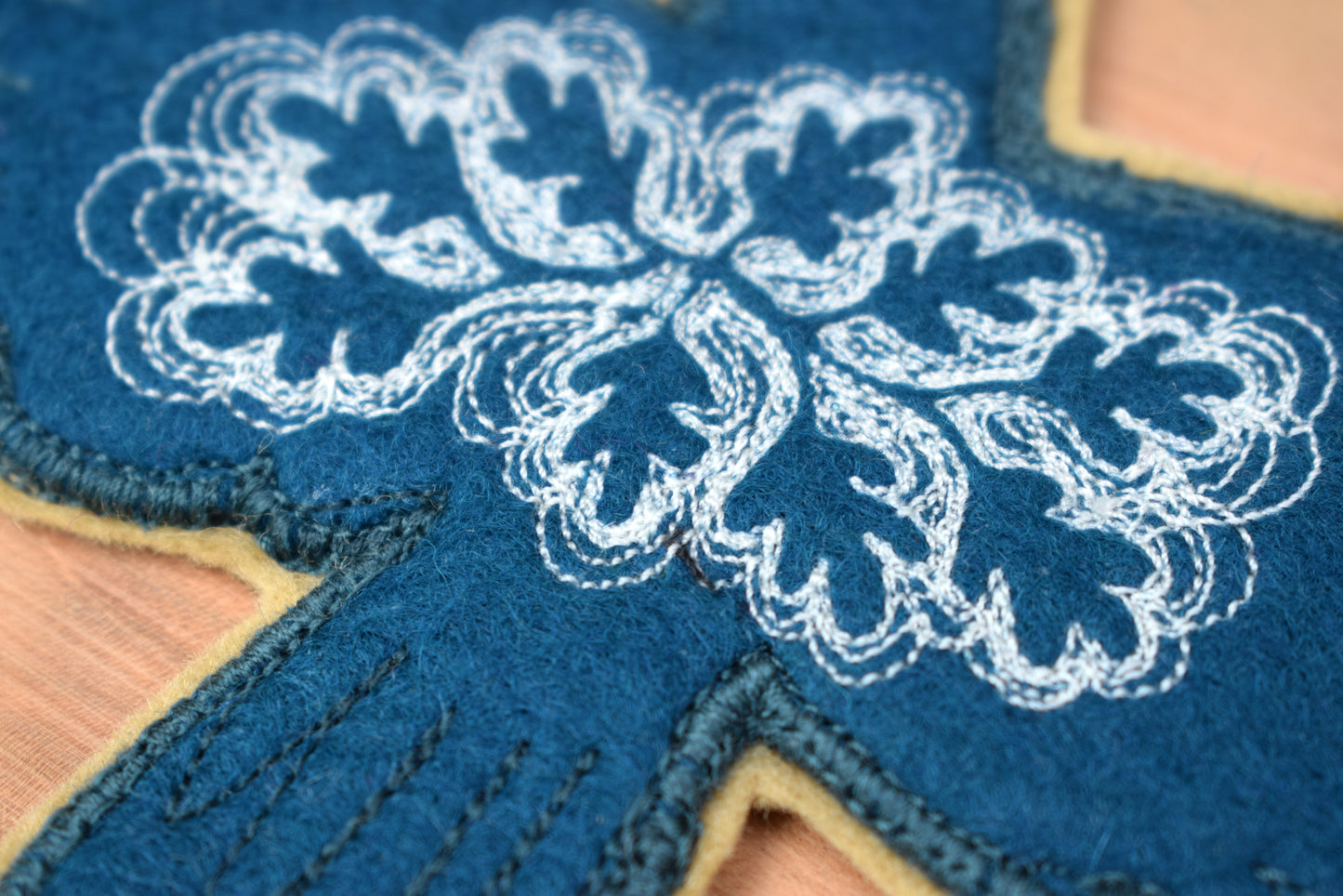 Embroidered leafy bird wall hanging