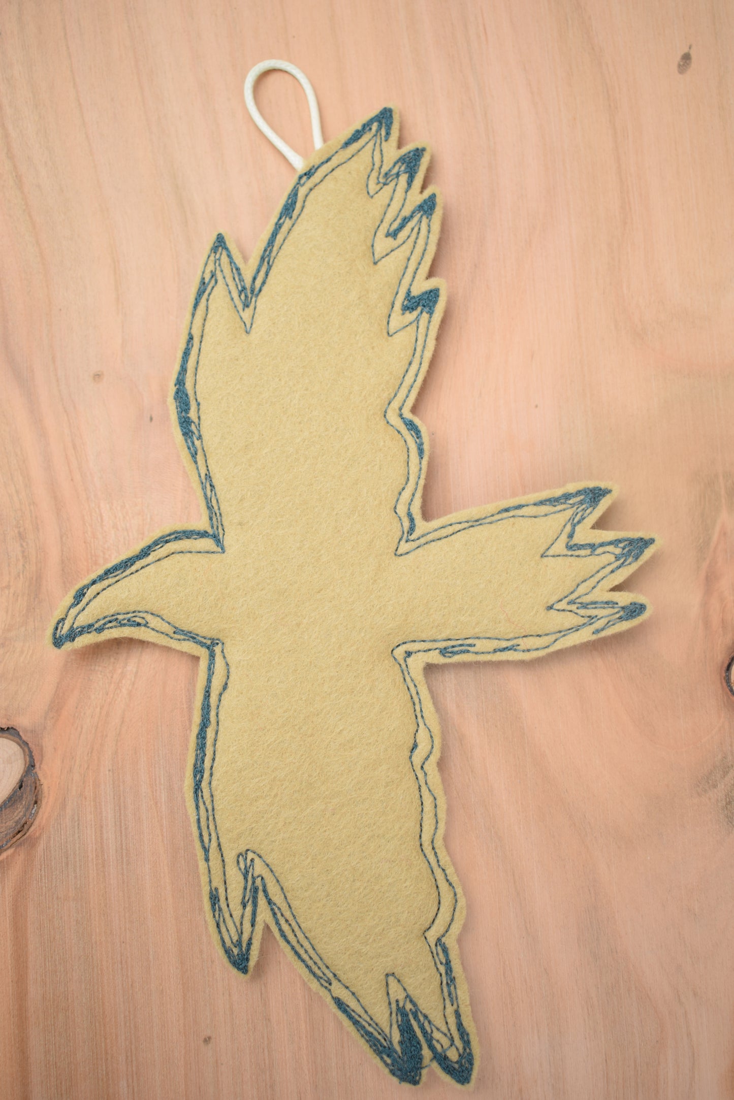 Embroidered leafy bird wall hanging