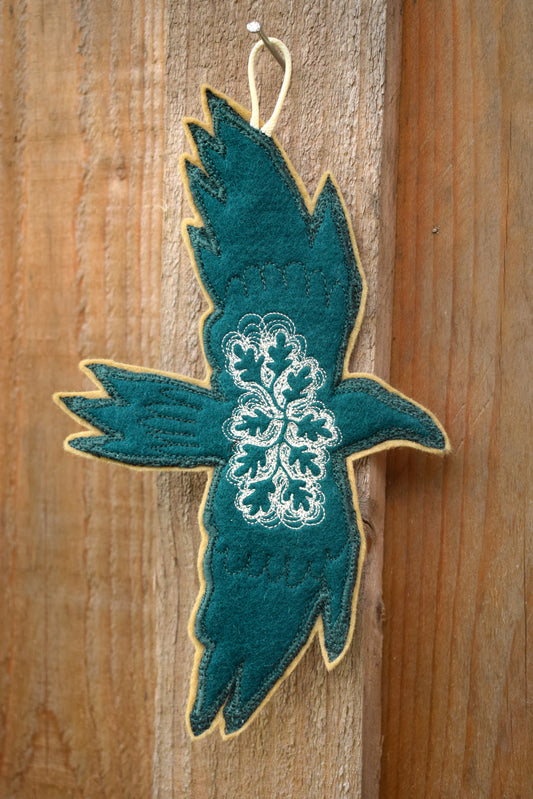 Embroidered leafy bird wall hanging