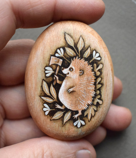 MINI Pebble - Hedgehog with Axe. Watercolour painting on Beech wood