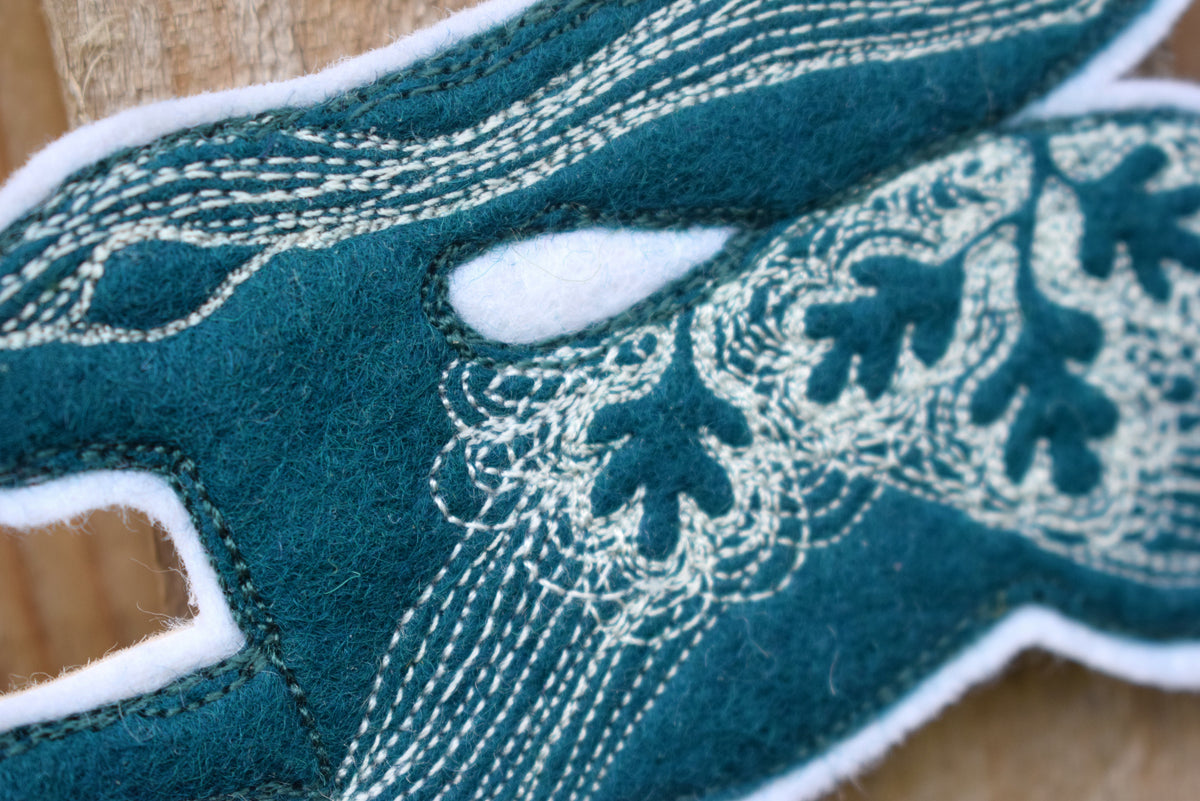 Embroidered leafy hare wall hanging