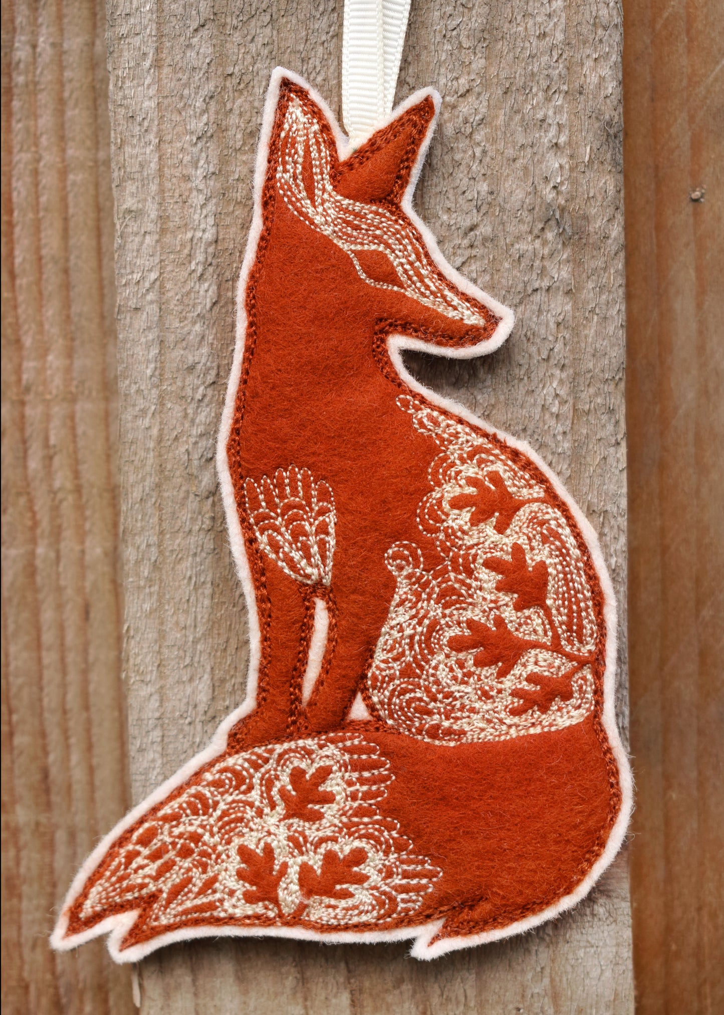 Embroidered leafy fox wall hanging