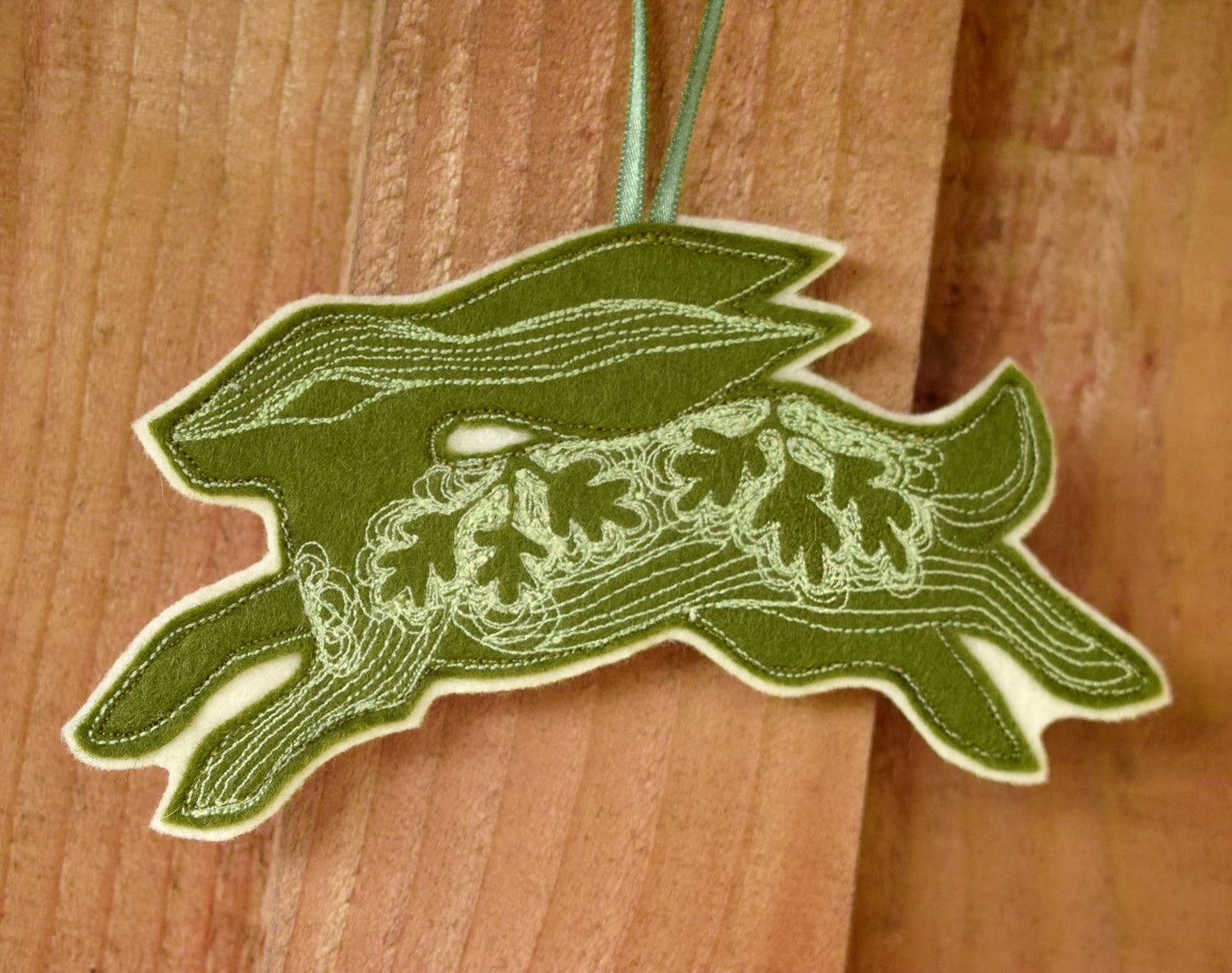 Embroidered felt hare wall hanging