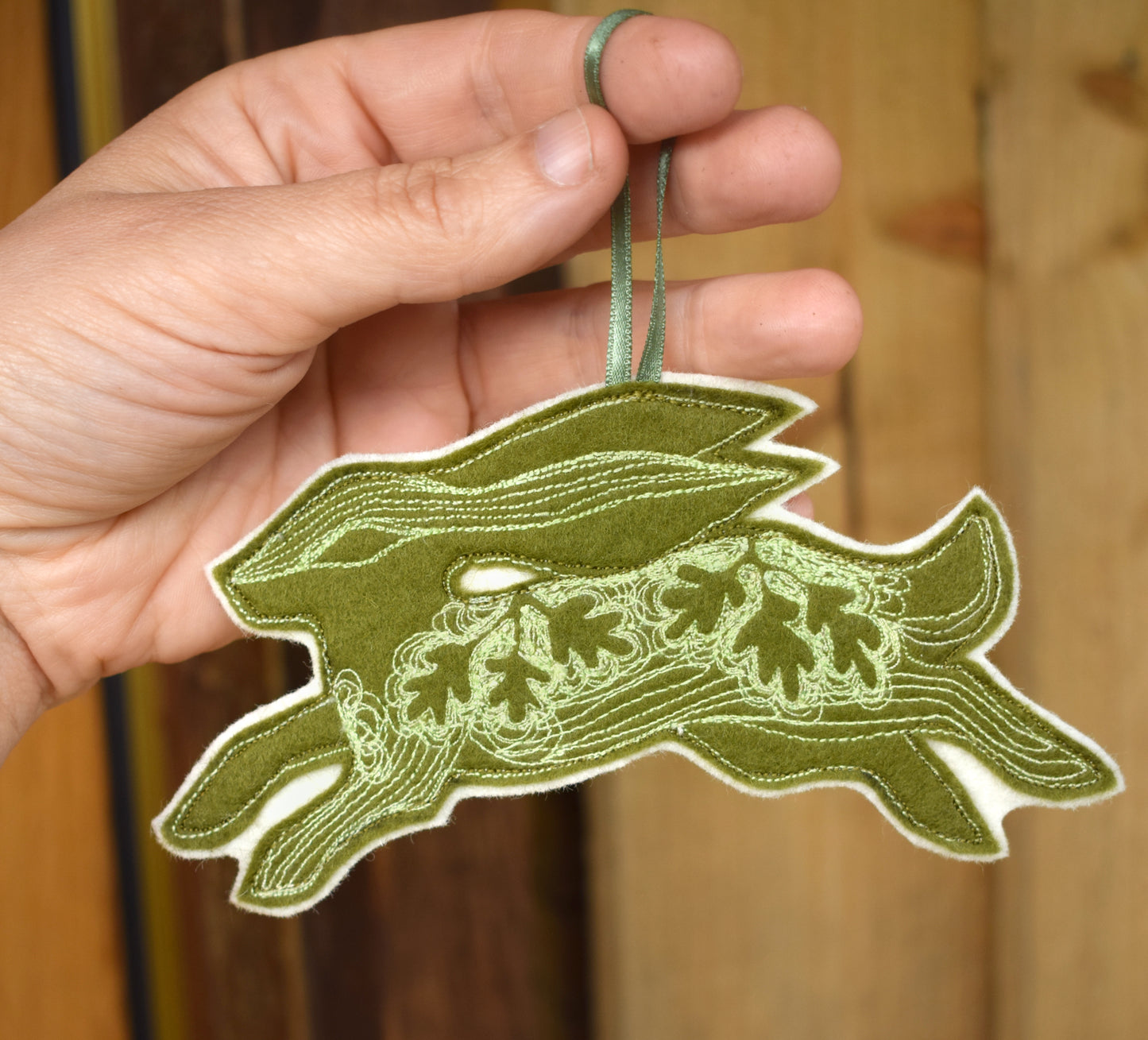 Embroidered felt hare wall hanging