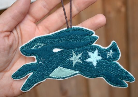 Embroidered felt hare wall hanging
