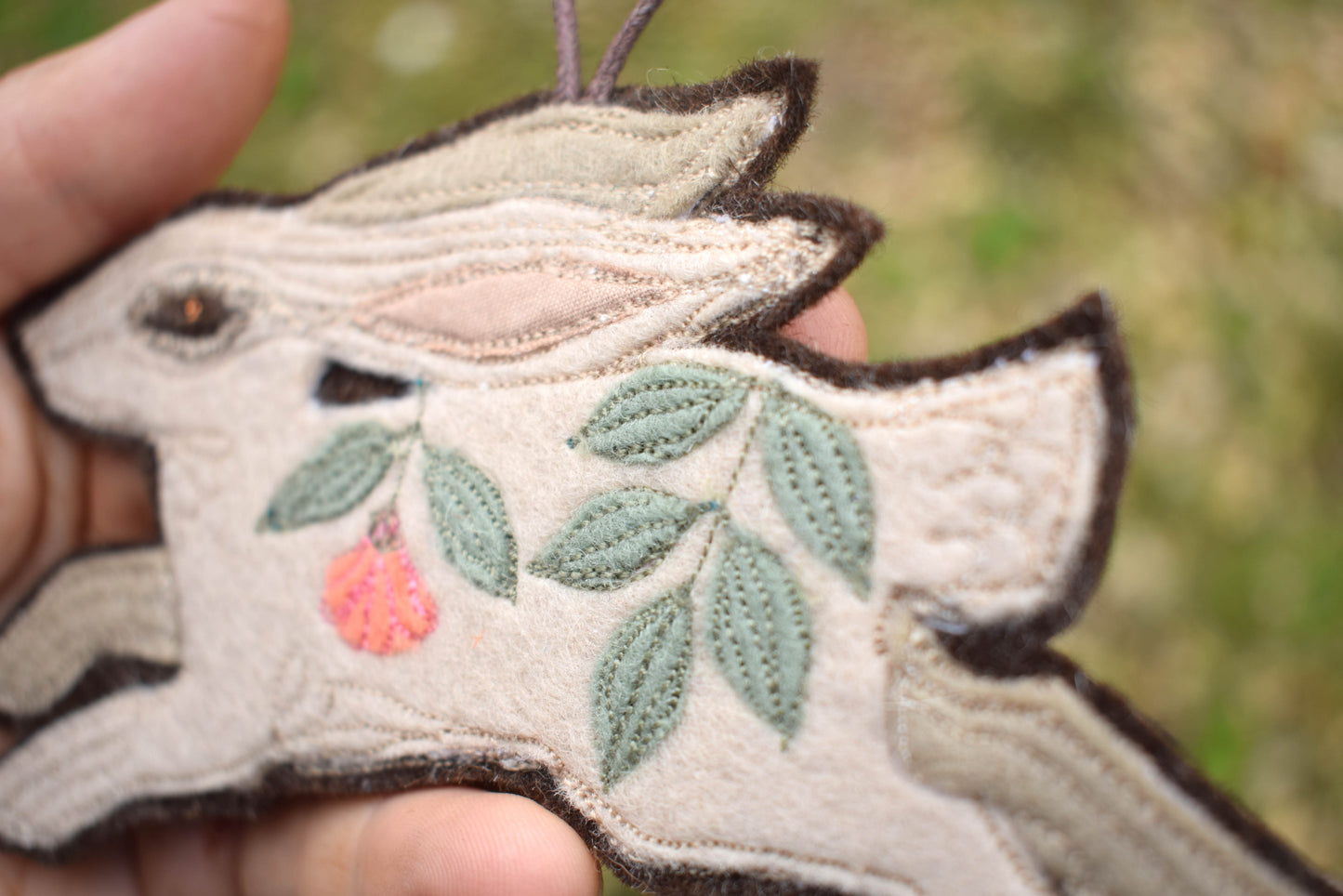 Embroidered felt leafy hare wall hanging