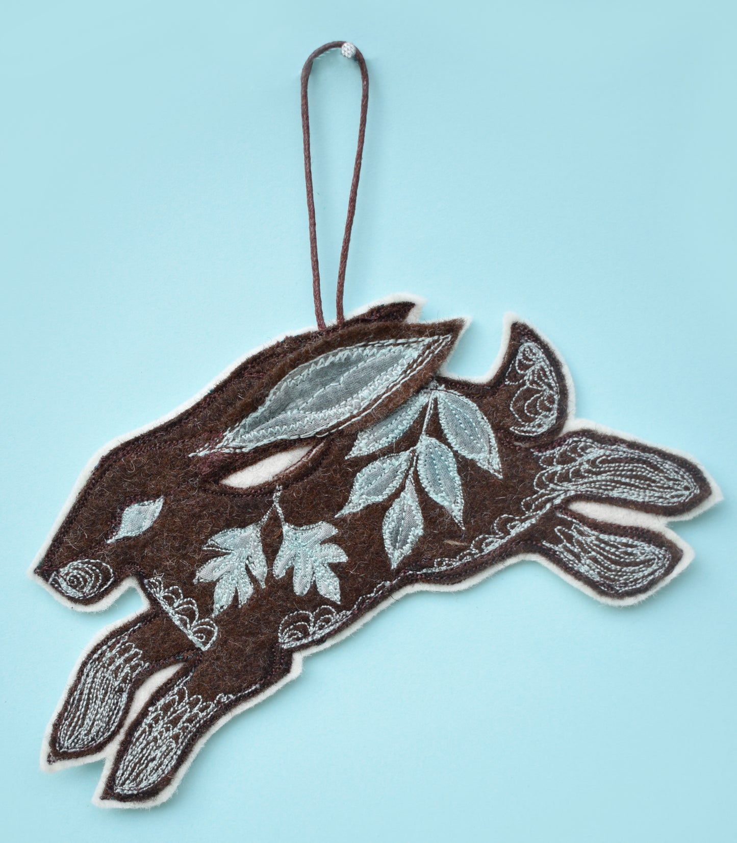 Embroidered felt and silk hare wall hanging