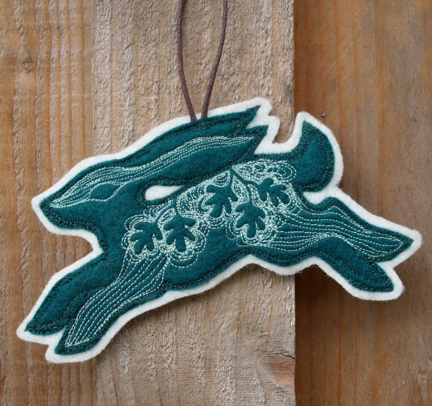 Embroidered felt hare wall hanging