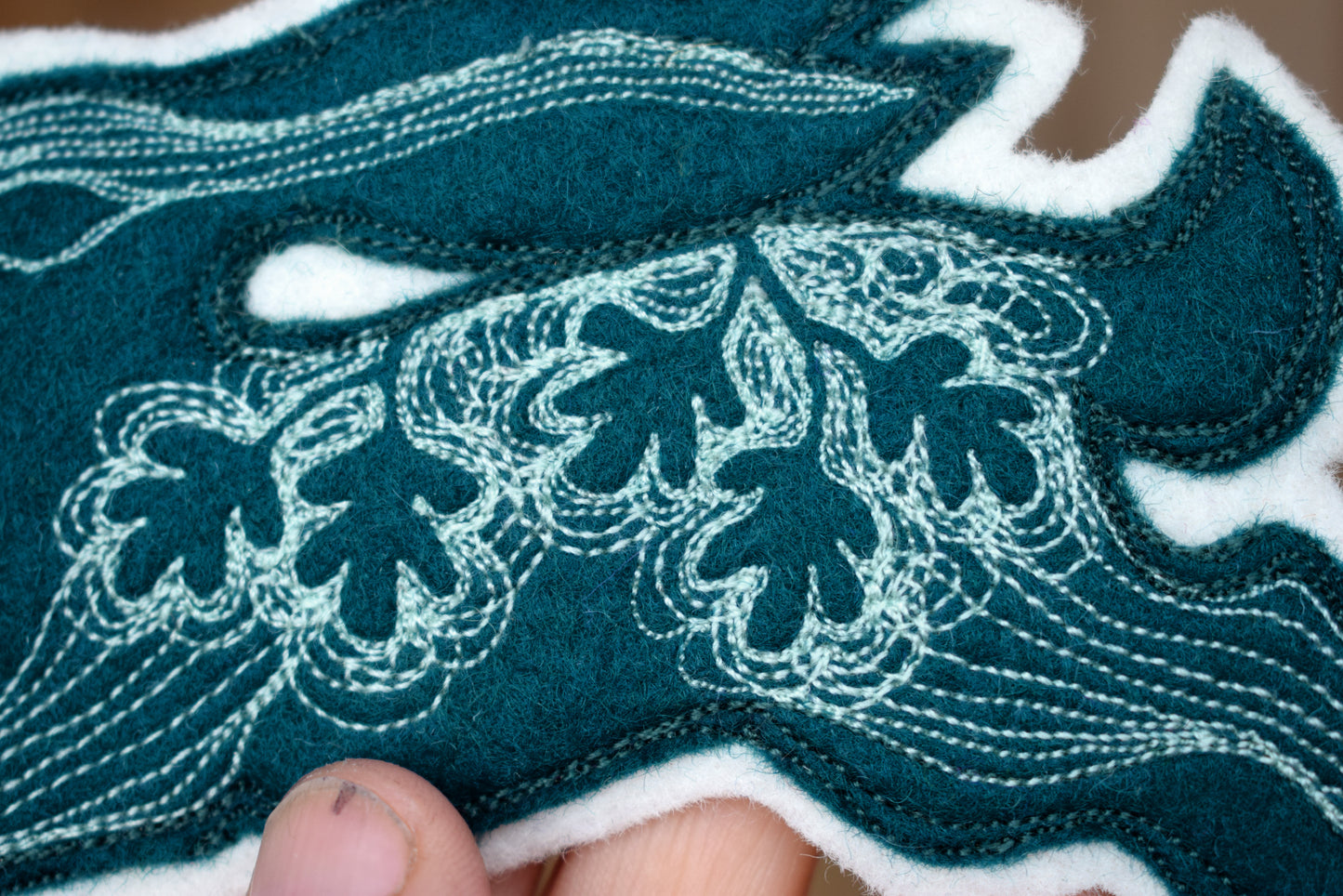Embroidered felt hare wall hanging