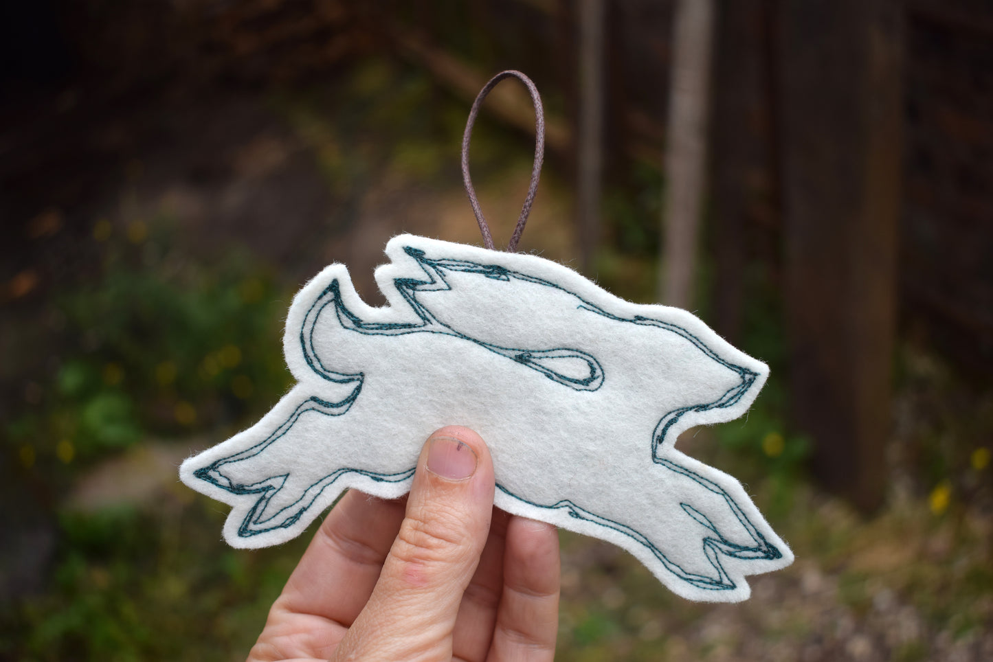 Embroidered felt hare wall hanging