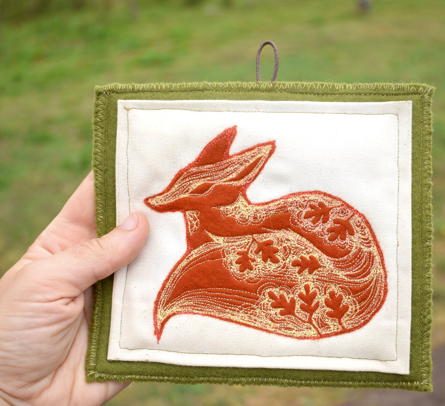 Embroidered leafy fox wall hanging