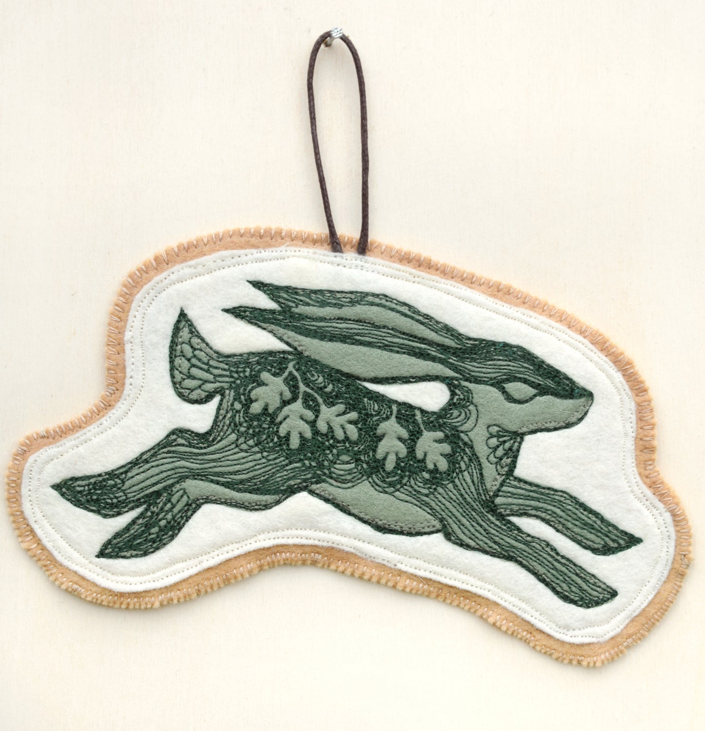 Embroidered leafy hare wall hanging