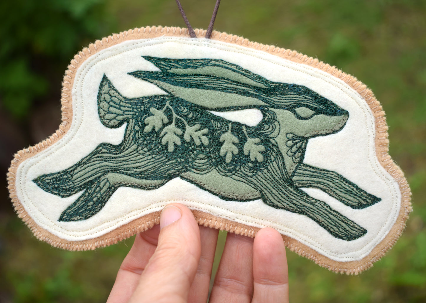 Embroidered leafy hare wall hanging