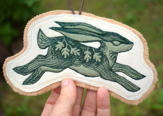Embroidered leafy hare wall hanging