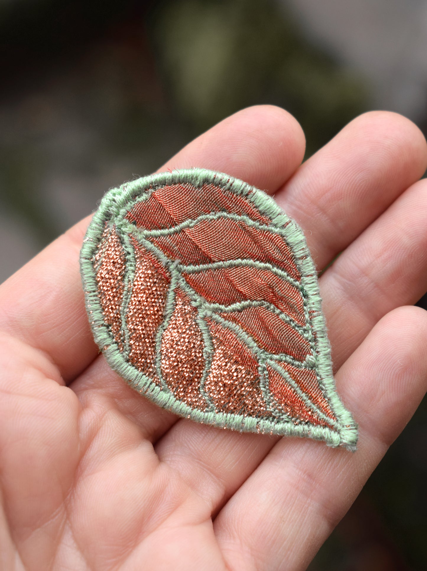 Green and Copper coloured leaf brooch