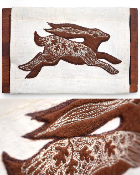 Embroidered leafy hare wall hanging